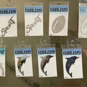 (Set Of 8)  Chrome Emblems (2 “Sport”, 2 Football, 3 Dolphins, 1 Double Dolphin)